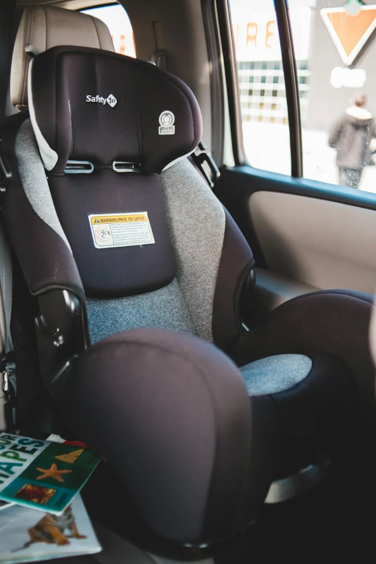 Child seat. strapped into the backseat of a Hyundai vehicle